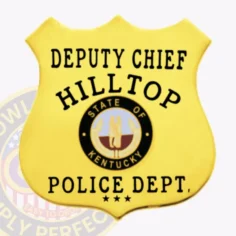 Gold custom metal shield badge for hilltop police deputy chief featuring safety pin backing, with deputy chief in strong black text at the top, hilltop centered in bold black letters, a detailed state of kentucky circular seal in the middle, and police dept. With three stars at the bottom on a smooth gold shield.