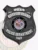 Custom Riverside Heights police SWAT badge in black metal shield form with safety pin attachment, showing SWAT in white text on a small curved tab at the top, RIVERSIDE HEIGHTS beneath it, the official State of Maryland seal centered, POLICE DEPARTMENT on a banner below, and 345 at the bottom.