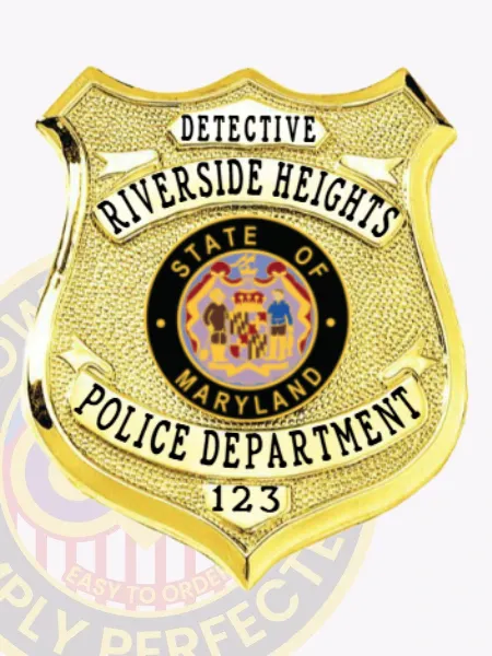 Custom gold shield metal badge for Riverside Heights police detective with textured gold finish and safety pin attachment, highlighting DETECTIVE in black uppercase letters on a small panel at the top, RIVERSIDE HEIGHTS below in curved text, the State of Maryland seal prominently displayed in the center, POLICE DEPARTMENT on a banner under it, and 123 printed near the bottom.