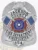 This sleek custom metal badge in silver color features a safety pin attachment for secure fastening. It prominently displays "JACKSON COUNTY FIRE DEPARTMENT FIREFIGHTER 854," along with the Texas state emblem and decorative flags, symbolizing dedication to service.