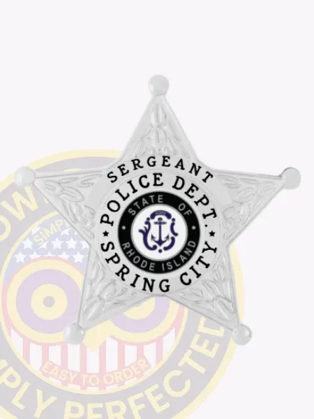 Five-point star silver metal badge for Spring City Police Sergeant, showing clear black text in a white circular banner around the Rhode Island state seal, attached by safety pin.