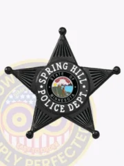 Custom black five-point star badge for Spring Hill Police, featuring a white circular banner with "Spring Hill Police Dept." text and central Minnesota state seal, designed with safety pin attachment.