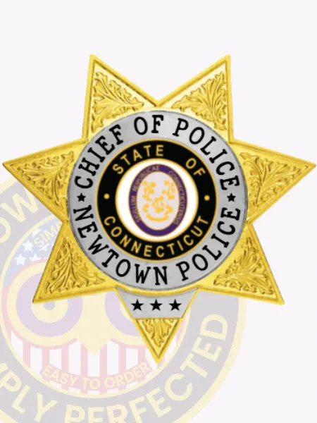 Custom gold 7 point star metal badge designed for Newtown police the chief of police, featuring detailed leaf embossing on every star arm, a central purple and gold state seal within a black ring, and bold white lettering encircling it that says “Chief of Police Newtown Police,” finished with a safety pin attachment.