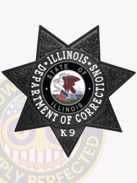 Custom metal badge in black with safety pin attachment, shaped like a star to signify authority and service. The badge features the words "Department of Corrections" prominently displayed around a central circular emblem that includes the state seal of Illinois, featuring an eagle and the state flag. The text "State of Illinois" encircles the seal, while "K9" is indicated at the bottom, designating the canine unit. This badge represents a commitment to law enforcement, emphasizing the important role of K9 teams within the corrections system.