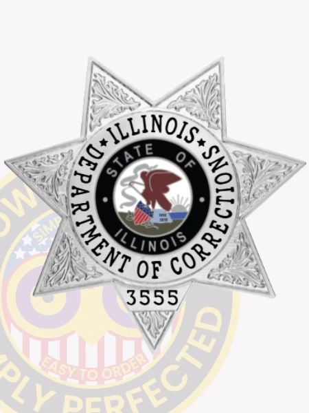 Custom metal badge in silver with safety pin attachment, designed in a star shape that signifies authority and service. The badge prominently displays the words "Department of Corrections" surrounding a central circular emblem featuring the state seal of Illinois, which includes an eagle and the state flag. The text "State of Illinois" encircles the seal, while the number "3555" is shown at the bottom, indicating a badge number. This badge represents professionalism and commitment within the corrections system, highlighting its role in law enforcement.