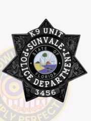 Polished silver 7 point star badge customized for Sunvale Police Officer, with ornate floral designs on each star tip, "OFFICER" atop in black letters, the Florida state emblem in the middle ringed by department text, and a safety pin fastener for easy wear.