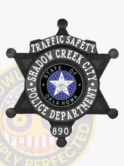Matte black 6 point star badge for Shadow Creek City Police Traffic Safety, highlighted by bright white embossed lettering and the colorful Oklahoma emblem at the center, complete with a safety pin attachment on the back.