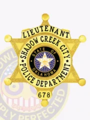 Shadow Creek City Police custom gold 6 point star badge for Lieutenant, showing “LIEUTENANT” in black letters on a curved gold plate, the Oklahoma state seal surrounded by “SHADOW CREEK CITY POLICE DEPARTMENT” text, and badge number “678” at the bottom, equipped with a safety pin.