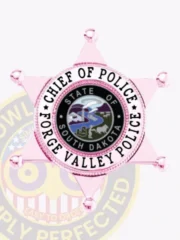 Pink six-point star metal badge designed for the Forge Valley Police Chief of Police, displaying the South Dakota state emblem in the center, surrounded by white and black ring text stating “Chief of Police” and “Forge Valley Police,” with a safety pin fastening on the back.