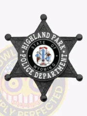 Six-pointed black metal star badge for Highland Park Police Department, displaying the Wyoming state seal in the center surrounded by bold white lettering, finished with a safety pin fastener for secure wear.
