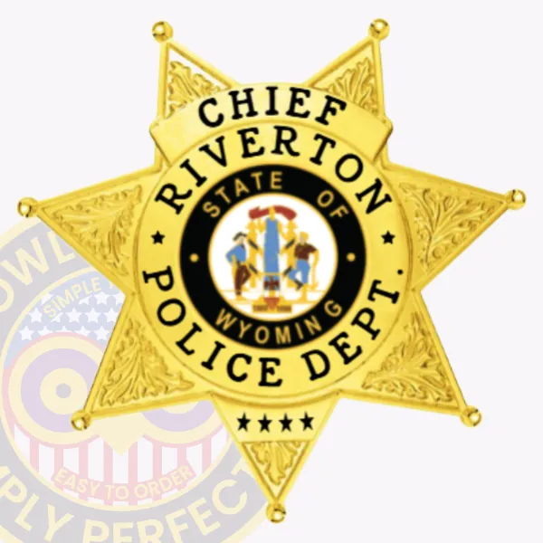 Gold seven-point star metal badge customized for Riverton police the chief, displaying detailed engraved foliage on every star tip, a central full-color Wyoming state seal, and black block letters encircling it stating “Chief Riverton Police Dept,” secured with a safety pin.