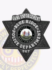 Blue Ridge Police custom black 6 point star badge for Gang Enforcement, showing bold white text around the official West Virginia state seal, with detailed leaf patterns embossed on the star points and a safety pin attachment for secure wear.