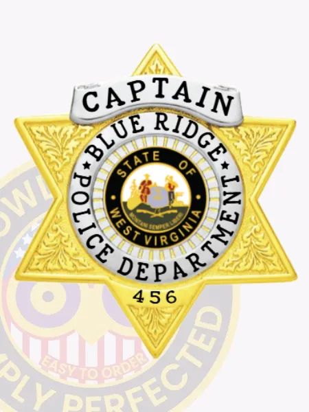 Polished gold 6 point star badge for Blue Ridge Police Captain, highlighting a white banner with black lettering for rank, a colorful West Virginia state seal centered within a ring of department text, ornate leaf motifs on the star surface, and a safety pin fastening on the reverse.