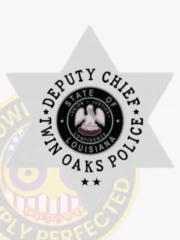 Six-point star silver metal badge for Twin Oaks Police Deputy Chief, containing the detailed Louisiana state seal in the center, bordered by black text that reads “Deputy Chief” and “Twin Oaks Police,” featuring a safety pin attachment.