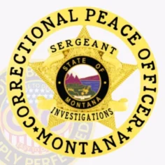 Close up of a custom metal badge in gold with safety pin attachment, featuring a star design that signifies authority. The badge prominently displays the words "correctional peace officer" encircling the badge. At the center, the state seal of montana showcases a scenic landscape with mountains and wildlife, surrounded by the text "state of montana. " above the emblem, the word "sergeant" is clearly indicated, while "investigations" is positioned below the central design. This detailed badge highlights professionalism and dedication within law enforcement.