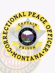 Custom metal badge in gold with silver star and with safety pin attachment, featuring a star-shaped design that symbolizes authority. The badge prominently displays the words "Correctional Peace Officer" around its outer edge. At the center, it showcases the state seal of Montana, which includes a scenic depiction of mountains and wildlife. The text "State of Montana" encircles the seal, and above it, the word "Captain" is clearly indicated. Below, the word "Prison" highlights the specific role within the corrections system. This badge represents professionalism and commitment to law enforcement.