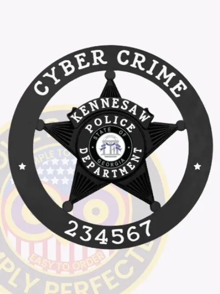 Bold black badge with a five-point star and a ring that says "Cyber Crime 234567 Kennesaw Police Department" in white text, highlighted by the State of Georgia seal in the middle, secured by a safety pin backing.