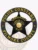 This striking custom metal badge in black color features a prominent star design at the center, surrounded by a circular border that reads "POLICE CONSTABLE" at the top and "FILMORE COUNTY" at the bottom. The badge highlights "EMERGENCY," "PARKER CITY," and "EAST," along with the state emblem of Texas, designed with a safety pin attachment for secure wear.