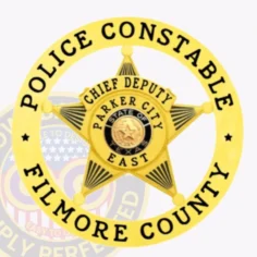 This elegant custom metal badge in gold color captures attention with its star shape and intricate details. It prominently displays "police constable," "filmore county," and "chief deputy," along with "parker city east" and the texas state emblem. A safety pin attachment ensures it can be worn securely on uniforms.