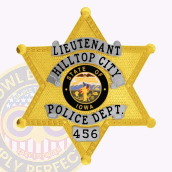 Hilltop City police lieutenant badge in gold metal with detailed texture, silver curved banners displaying "LIEUTENANT," "HILLTOP CITY," and "POLICE DEPT.," a vibrant Iowa state emblem in the middle, and a safety pin attachment.