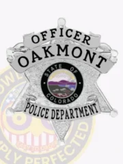 Silver 6 point star metal badge custom-made for Oakmont police officer, showing black text "OFFICER" at the top, "OAKMONT" in the center, a colorful State of Colorado emblem, and "POLICE DEPARTMENT" at the bottom, equipped with a safety pin for easy attachment.