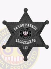 Black 6 point star metal badge for Brookside PD Bayou Patrol, displaying white lettering around the Louisiana state emblem in the center, with “BAYOU PATROL” on a curved plate at the top, “BROOKSIDE PD” below, and badge number “123,” embossed leaf designs, and rounded star points.