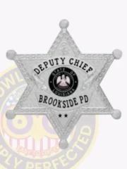 Brookside Police custom silver 6 point star badge for Deputy Chief, displaying “DEPUTY CHIEF” on a raised silver banner at the top, the Louisiana state seal surrounded by “BROOKSIDE PD” text in black, detailed leaf engravings on the star surface, and a safety pin on the back.