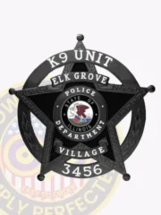 Elk Grove Village Police K9 Unit badge in custom black metal, designed as a 5 point star within a round panel, displaying white text "K9 UNIT," "ELK GROVE VILLAGE," and the identification number "3456," attached by safety pin.