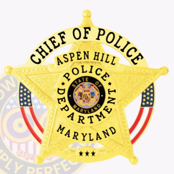 Custom gold 5 point star metal badge for Aspen Hill Police Chief of Police, featuring a circular banner with "Chief of Police" at the top, Maryland state seal in the center, and safety pin attachment.