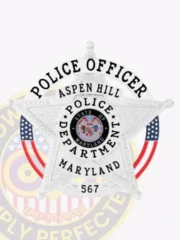Silver custom metal badge for Aspen Hill Police Officer, five-point star design with circular banner text, including the Maryland state emblem in the center and safety pin attachment for easy wear.