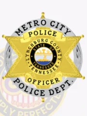 Metro City Police custom badge showing a gold 6 point star within a silver ring inscribed with "METRO CITY POLICE DEPT." in black letters, the star including yellow banners labeled "POLICE" and "OFFICER," and a center displaying the Tennessee state seal and "LYNCHBURG COUNTY TENNESSEE," secured with a safety pin.