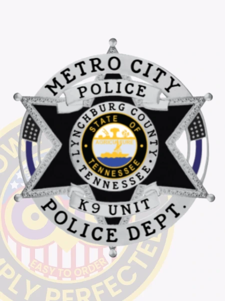 Black metal six-point star badge for Metro City Police K9 Unit, placed inside a silver circle engraved with "METRO CITY POLICE DEPT." in black, featuring white scroll banners with text "POLICE" and "K9 UNIT," and a detailed Tennessee state seal in the center, attached with a safety pin.
