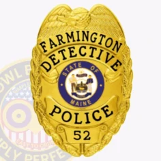 This image showcases a custom metal badge in a radiant gold color, prominently displaying "farmington detective police. " the badge features a safety pin attachment, ensuring secure fastening for detectives who need to present their credentials confidently.