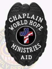 This elegant custom metal badge in black color with a safety pin attachment displays the words "CHAPLAIN," "WORLD HOPE MINISTRIES," and "AID." The badge's centerpiece features a bold black circle with a colorful cross, reflecting commitment and support.