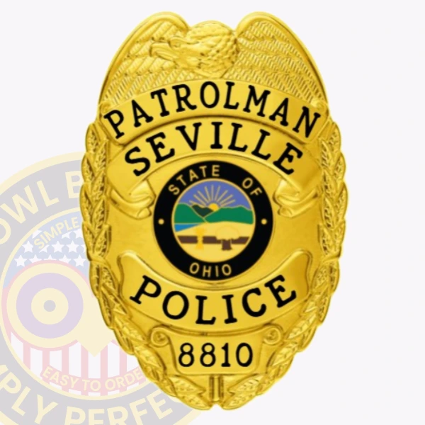 A polished custom metal badge in gold with black lettering, shaped like a shield and adorned with intricate details. The badge displays "PATROLMAN" at the top and "SEVILLE POLICE" below in bold black letters for clear visibility. In the center, the state seal of Ohio features a rising sun over a landscape, encircled by a black ring. The badge also includes the number "8810" at the bottom. The shiny gold finish of this custom metal badge in gold with black lettering emphasizes its elegance and authority, making it a distinguished symbol of law enforcement pride.