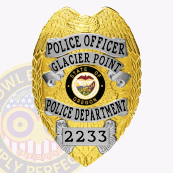This detailed close up of a custom metal badge in gold color with silver panels featuring an eagle design at the top. The badge prominently displays the title "POLICE OFFICER" along with "GLACIER POINT POLICE DEPARTMENT" and the state seal of Oregon in the center. The badge number "2233" is clearly visible at the bottom, and it is designed with a safety pin attachment for secure fastening.