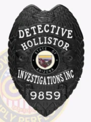 Presented is a custom metal badge in bold black, featuring the title "DETECTIVE HOLLISTOR" and the central emblem of Arizona. The safety pin attachment ensures secure wear, making it suitable for those in investigative roles who prioritize both functionality and style in their identification.