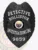 Presented is a custom metal badge in bold black, featuring the title "DETECTIVE HOLLISTOR" and the central emblem of Arizona. The safety pin attachment ensures secure wear, making it suitable for those in investigative roles who prioritize both functionality and style in their identification.