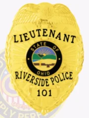 Gold metal badge with an eagle perched at the top, customized for Riverside Police Lieutenant, displaying black lettering on curved gold ribbons stating "LIEUTENANT," "RIVERSIDE POLICE," and badge number "101," encircling the vibrant Ohio state emblem, secured by a safety pin.