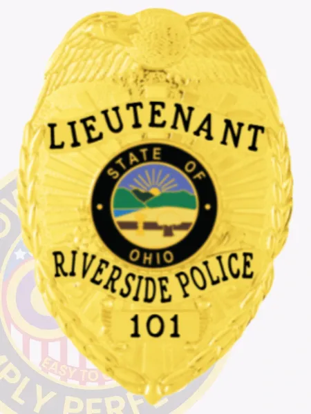Gold metal badge with an eagle perched at the top, customized for Riverside Police Lieutenant, displaying black lettering on curved gold ribbons stating "LIEUTENANT," "RIVERSIDE POLICE," and badge number "101," encircling the vibrant Ohio state emblem, secured by a safety pin.