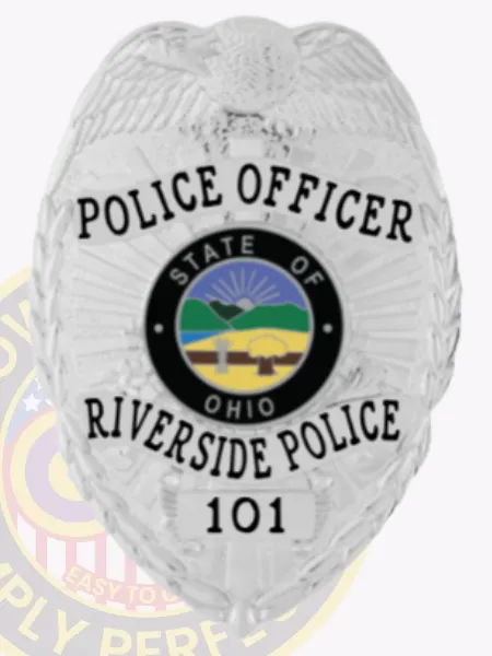 Riverside Police Officer custom silver metal badge showcasing an eagle with spread wings atop the shield, silver banners with black text highlighting rank and department, centered around a multicolor Ohio state seal, finished with badge number "101" and a safety pin fastener.