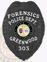 Greenwood Police Forensics custom black metal badge showcasing an eagle with spread wings atop the shield, black banners with white text highlighting the forensic unit and department name, centered around a multicolor South Carolina state seal, designed with a safety pin fastener.