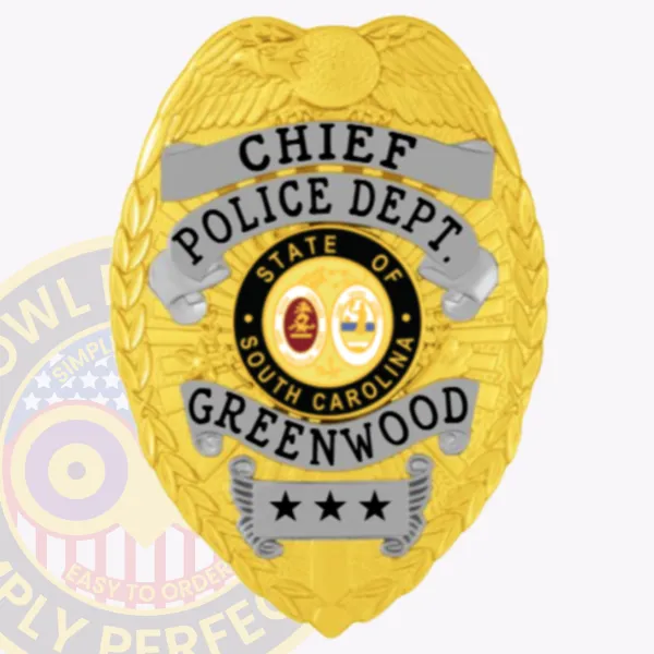 Custom gold eagle top metal badge for Greenwood Police Chief featuring black text on silver banners reading "CHIEF," "POLICE DEPT.," and "GREENWOOD," surrounding a colorful South Carolina state seal in the center, with three black stars on a silver plate at the bottom and a safety pin attachment.