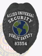 Stylish black metal badge showcasing the words "ALLIED UNIVERSAL SECURITY PUBLIC SAFETY" above a circular globe design. The safety pin attachment ensures it remains securely in place, making it ideal for uniform wear. This custom metal badge in black color with safety pin attachment reflects authority and vigilance in the security field.