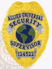 Custom metal badge in a striking gold color, featuring silver panels on the top and bottom, with the words "ALLIED UNIVERSAL SECURITY SUPERVISOR" elegantly displayed above a globe design. The badge includes a durable safety pin attachment for secure wear. This custom metal badge in gold color with silver panels and