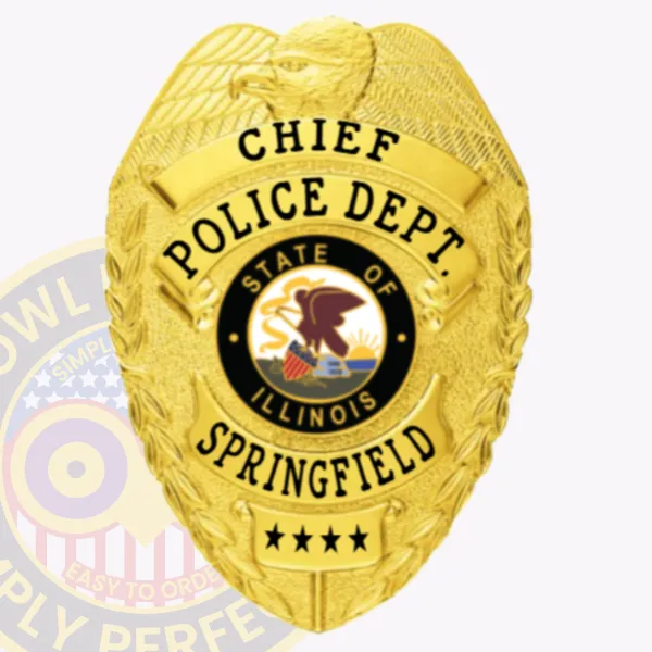 Shiny gold metal badge for Springfield Police Chief, featuring an eagle crest and black lettering on curved banners reading "CHIEF POLICE DEPT. SPRINGFIELD," a central Illinois state emblem, and four stars on the lower plate, secured with a safety pin fastener.