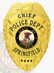 Springfield Police Chief custom gold metal badge with an eagle figure on top, black text bands saying "CHIEF," "POLICE DEPT.," and "SPRINGFIELD," a colorful Illinois seal in the center, and four stars at the bottom, designed with a safety pin attachment.