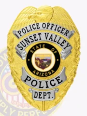 A striking custom metal badge in gold color featuring silver panels, showcasing the words "Police Officer" and "Sunset Valley" prominently at the top. The badge includes a central emblem representing the state of Arizona, surrounded by a black circle that highlights the police department. Attached securely is a safety pin for easy wear.