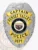This elegant custom metal badge shines in silver with eye-catching gold panels, highlighting the title "Captain" and "Sunset Valley." The badge’s center showcases Arizona's emblem within a black circle, surrounded by the words "Police Dept." A reliable safety pin attachment ensures it can be worn conveniently.