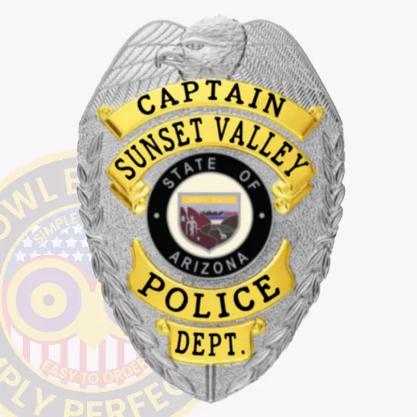 Featuring a sophisticated custom metal badge in shiny silver complemented by gold panels, this badge displays "Captain" alongside "Sunset Valley." The central design includes an emblem of Arizona, encircled by a black band indicating the police department. A safety pin attachment allows for practical use.
